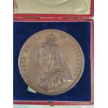 A CASED COPPER 1887 JUBILEE MEDALLION DESIGNED BY SIR JOSEPH BOEHM WITH A BUST OF THE QUEEN ON ONE