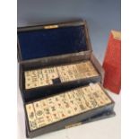 A YAMANAKA BLUE LEATHER CASED BONE AND BAMBOO MAHJONG SET, THE CASE. W 29.5cms.