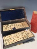 A YAMANAKA BLUE LEATHER CASED BONE AND BAMBOO MAHJONG SET, THE CASE. W 29.5cms.