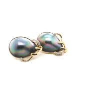 A PAIR OF BLACK MABE PEARL AND DIAMOND LARGE STUD EARRINGS FITTED WITH A LEVER BACK SAFETY.