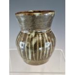 LADI KWALE (CIRCA 1925-1984), AN ABUJA POTTERY VASE, THE BASE OF THE THISTLE SHAPE BELOW STRIATED
