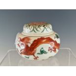 AN ARITA POLYCHROME INCENSE JAR AND COVER, THE BUN SHAPED BODY PAINTED WITH AN IRON RED DRAGON