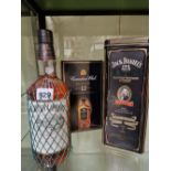 WHISKY:A TIN BOXED LITRE BOTTLE OF JACK DANIELS, A LITRE BOTTLE OF SOUTHERN COMFORT TOGETHER WITH