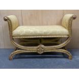 A 19th C. STYLE GILT WOOD WINDOW SEAT UPHOLSTERED IN YELLOW DAMASK, THE ARMS SCROLLING DOWN TO