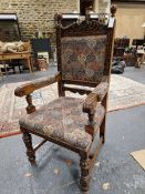 A SET OF TEN LATE STEWART STYLE OAK CHAIRS TO INCLUDE TWO WITH ARMS, THE UPHOLSTERED BACKS BETWEE