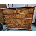 A GEORGIAN CROSS BANDED WALNUT CHEST OF TWO SHORT AND THREE LONG DRAWERS ON BRACKET FEET. W 97 x D