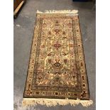 AN ORIENTAL RUG OF CAUCASIAN DESIGN. 222 x 123cms