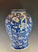 A CHINESE BLUE AND WHITE BALUSTER VASE PAINTED WITH CHERRY BLOSSOMS ON A BLUE CRACKED ICE GROUND,