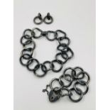 A DESIGNER PARIS HOUSE LONDON SIGNED SUITE COMPRISING OF BROAD LINK BRACELET, NECKLACE AND CLIP ON