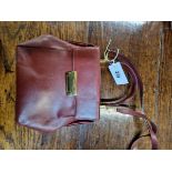 A SALVATORE FERRAGAMO CLUTCH HANDBAG. (27 x 21 cm)