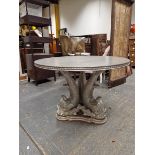 A CONTEMPORARY SILVERED CIRCULAR TABLE SUPPORTED ON A THREE DOLPHIN COLUMN AND TRIPARTITE FOOT. Dia.