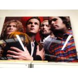 •DEAN CHALKLEY. ARR. THE KILLERS, COLOUR PHOTOGRAPHIC PRINT. ENCASED IN PERSPEX WITH METAL FRAME