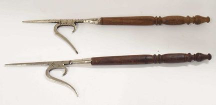 Pair of nickel plated pike heads on small turned wooden handles (a/f), rust on pike heads, approx