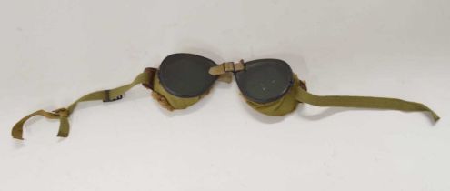 Pair of 20th century military wool lined green glass tinted motorcycle/dust goggles (a/f), strap has