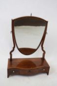 19th century mahogany framed dressing table mirror, the shield shaped panel supported on a