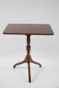 19th century mahogany wine table, the rectangular top over a turned column with tripod base 64cm