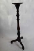 Late Victorian mahogany torchere plant stand, circular top over a baluster turned column and