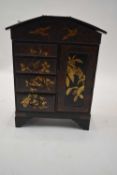 Late 19th century Japanese black lacquer and floral decorated table cabinet with hinged lidded top