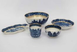 Group of Caughley wares including a slop bowl, (cracked), a shaped tea pot stand, Caughley cup and