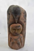 Tribal/ethnographica interest - a heavy dense hardwood floor standing figure surrounded by birds,