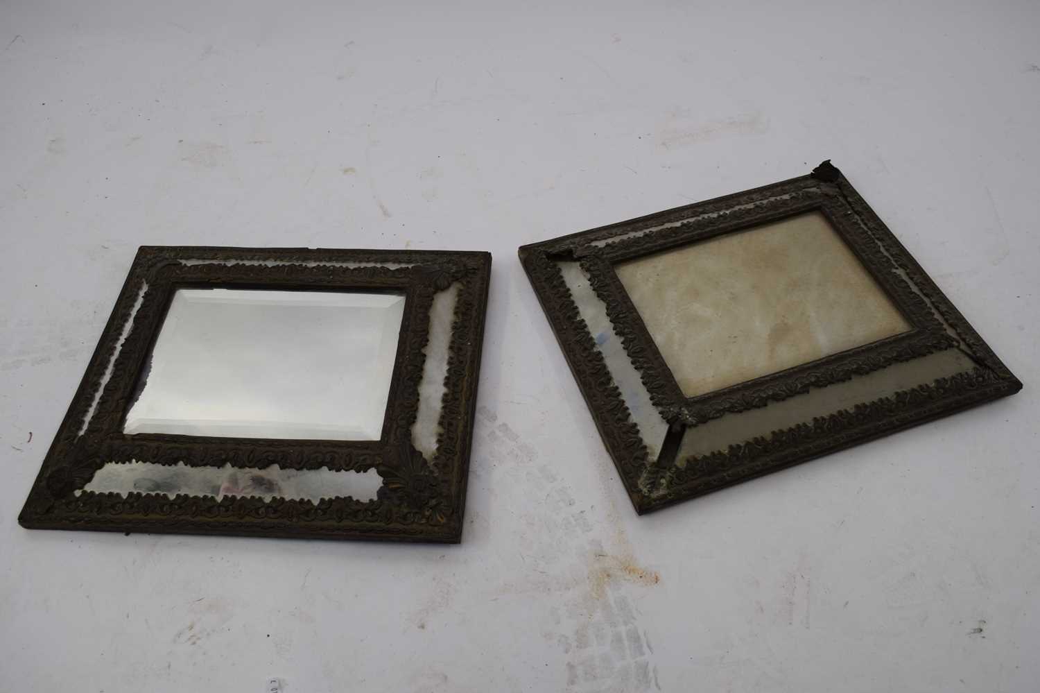Pair of 19th century cushion formed mirrors with pressed brass decoration, 38cm high (one a/f)