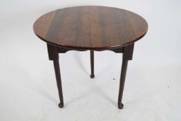 18th century oak and elm cricket table, the circular top raised on three tapering circular legs with