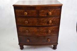 Victorian mahogany bow front chest of two short over three long drawers with turned knob handles