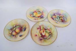Group of four hand painted Minton fruit plates, signed by various artists including Plums, signed by