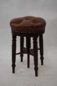 Victorian mahogany framed and leather upholstered revolving piano stool, 50cm high