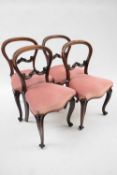 Set of four Victorian mahogany framed balloon back dining chairs with pink upholstered seats and