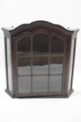 Small late 19th or early 20th century oak wall display cabinet with single glazed arched door