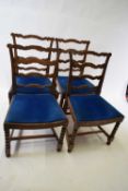 Set of four late 19th or early 20th century oak framed ladderback dining chairs, with blue push