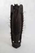 Tribal/ethnographica interest - Papua New Guinea dark wooden mask formed as an anthropomorphic