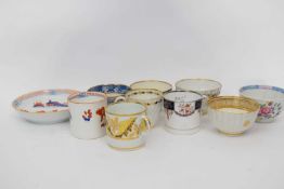 Group of English porcelains including a Derby can, Machin can, quantity of tea bowls including Derby