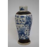 19th century Chinese porcelain vase decorated in underglaze blue with a dragon chasing the flaming