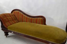 Victorian mahogany framed chaise longue with shaped back raised on short turned legs, approx 200cm