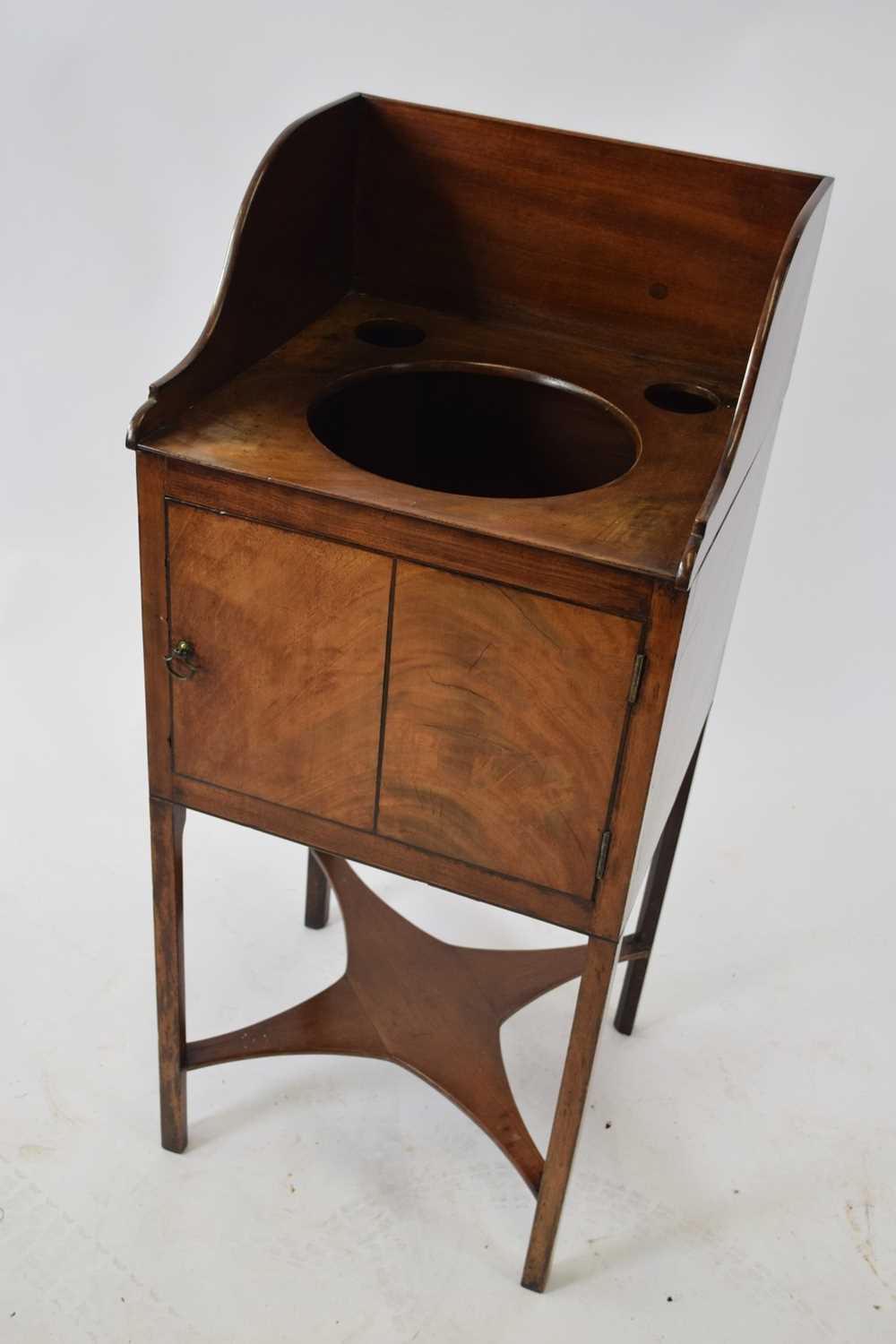 19th century mahogany wash stand of square form with galleried back, three apertures and a single