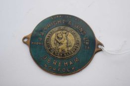 Green enamel badge with St Christopher emblem to centre, retailed by J J Wright & Sons Ltd, Dereham,