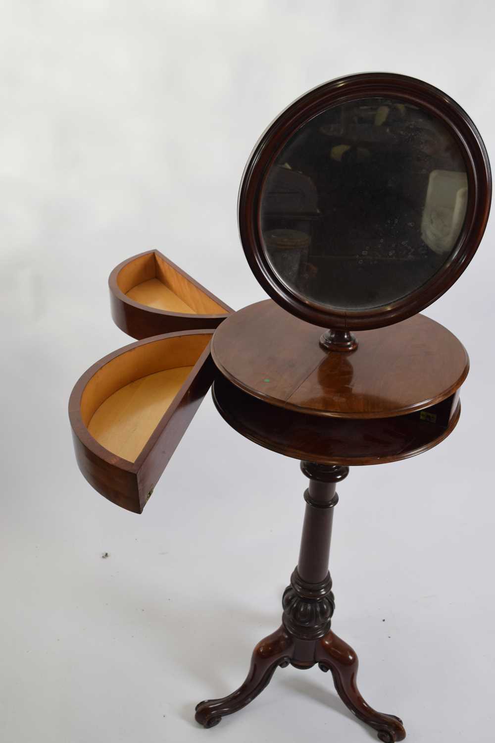 Victorian mahogany shaving stand, the circular mirror over a circular centre section with two spring