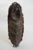 Tribal/ethnographica interest - Papua New Guinea mask of oval form set with large cowrie shell