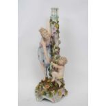 Large Continental porcelain candlestick with a floral design in relief and the central column