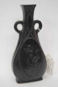 Royal Doulton vase by Leslie Harradine of flat ended form, the black ground decorated with