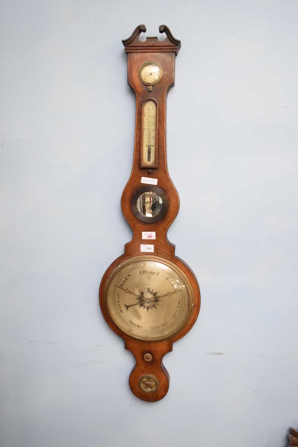 19th century mahogany cased barometer with broken arch pediment over a body with damp/dry meter,