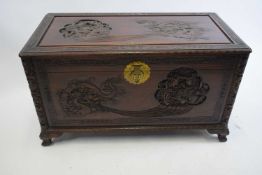 Early 20th century Cantonese camphor wood blanket box decorated with carved detail, 103cm wide