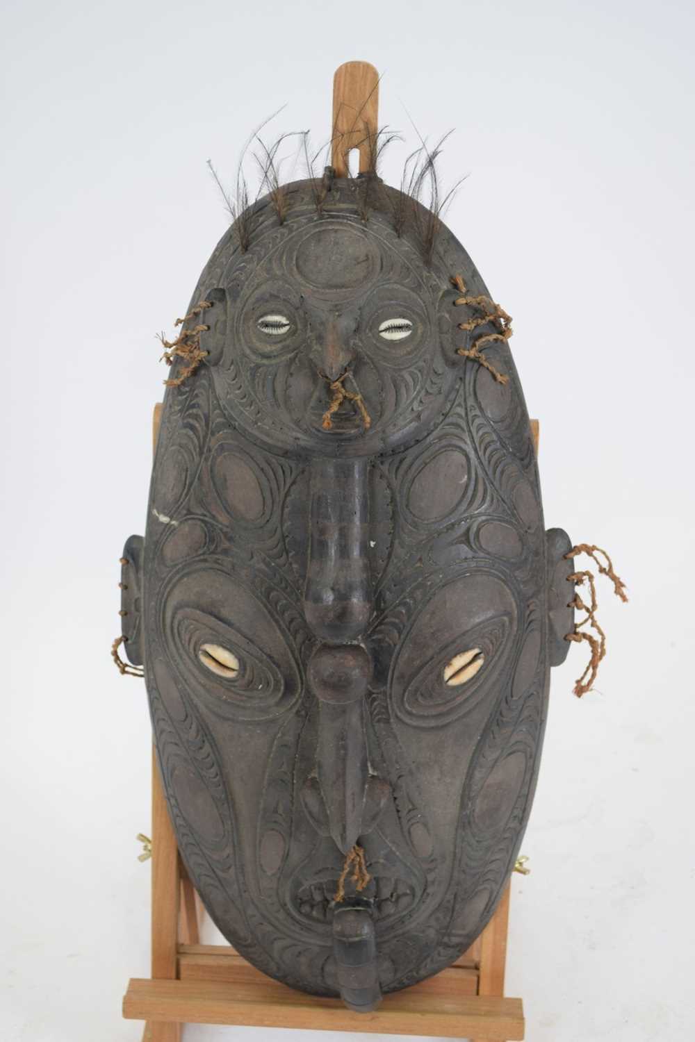 Tribal/ethnographica interest - Papua New Guinea oval mask with two anthropomorphic faces set with