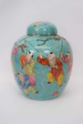 Chinese porcelain ginger jar and cover, the celadon type ground decorated in polychrome with Chinese