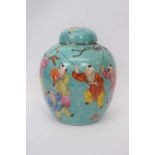 Chinese porcelain ginger jar and cover, the celadon type ground decorated in polychrome with Chinese