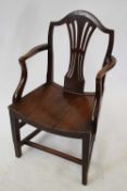 19th century elm carver chair with arched back, pierced central splat, tapering legs with cross