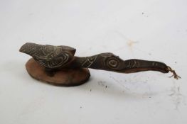 Tribal/ethnographica interest - Papua New Guinea wooden model of a stylised bird with inset eyes and