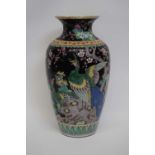 Chinese porcelain famille noir vase decorated in polychrome with exotic birds amongst flowers,